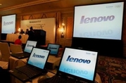 Computer monitors show the logo of Lenovo during a news conference for its interim results announcement in Hong Kong November 9, 2006. Lenovo said on Monday it would start selling laptop computers preloaded with Linux software from Novell Inc. instead of Microsoft Corp.'s Windows operating system. (Paul Yeung/Reuters)